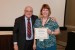 Dr. Nagib Callaos, General Chair, giving Prof. Maureen Schafer a certificate of appreciation for volunteering time and effort to make an additional presentation for
Interdisciplinary Communication.
